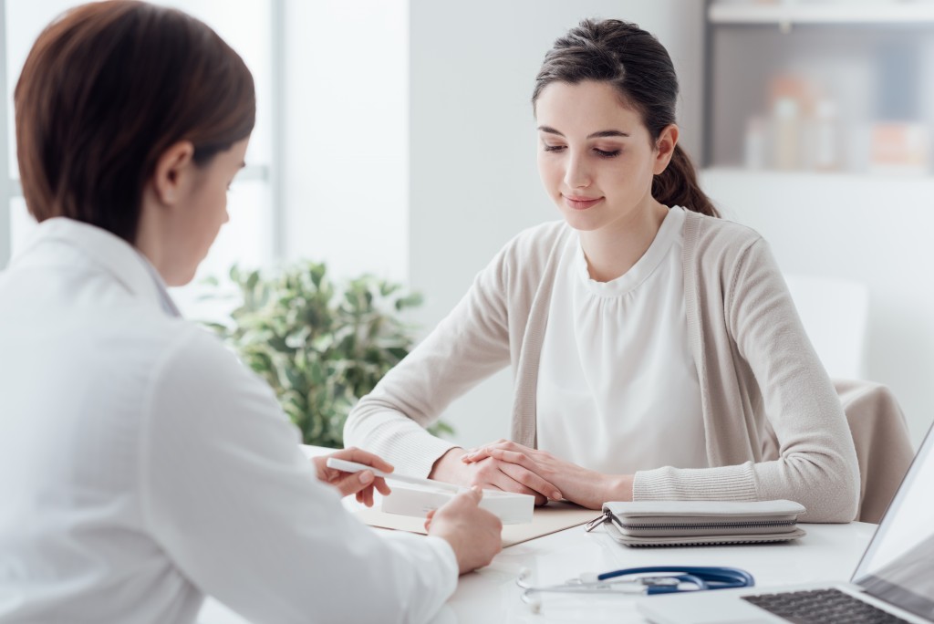 woman consulting a doctor