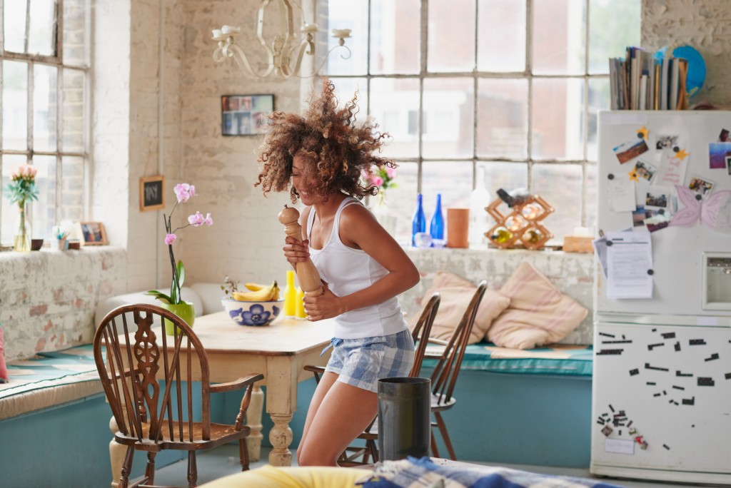 woman dancing in her house