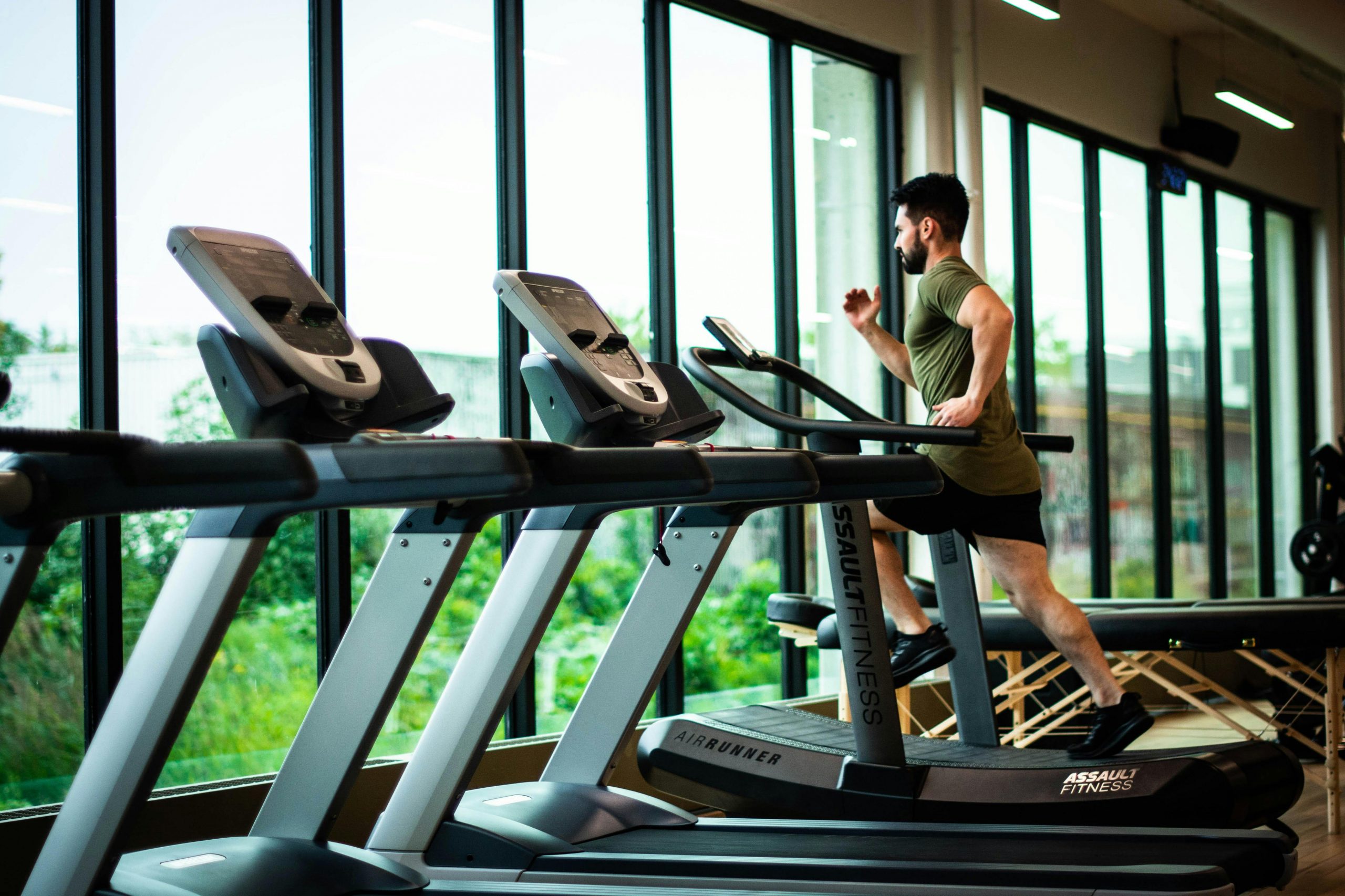 man running on a treadmill at the gym